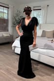 Dress was a little tight getting into but fit like a glove. Nice thick material with some stretch. Beautiful mermaid style dress to give you a curvy elegant look. Just needed it shortened in the hem. - Kristi W.