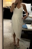 This dress is very cute and comfortable. It's easy to dress up your look just by throwing this on. It's not see-through but the base layer shows through the top layer. That is what I'm pointing to. - Lauren L.