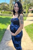 I was in search of a dress to attend a wedding and needed to find one that would have a bit of stretch to accommodate my growing baby bump (22 weeks). I'm usually a medium or large and currently 160 lbs. Large was perfect and comfy. - Mika B.