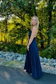 I bought this dress to wear as a wedding guest and I loved everything about the fit through the shoulders and waist but it was unfortunately insanely long! I didn't have time to have it hemmed before the event so I had to pin it up with safety pins. It's a gorgeous dress though and I got lots of compliments! - Rachel C.