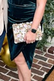 I got SO many compliments on this bag. It's such a stunner! One of the flowers did come off. If I knew how to sew, I'd put it back on but it's still a great use! - Sydney M.