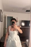 This dress is ABSURDLY wide and poofy. I ordered a small and the top part fits tight enough but the sleeves are too long and fall off. And the hips. THE HIPS! Please see pics. I look like an exploded marshmallow. Immediate return. :( - Carmen G.