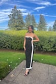 I wore this to a wedding reception and received many compliments. I LOVED the way it hugged my body. As a girlie with a smaller chest, I was surprised the dress held up so well. The fabric is very breathable. I felt comfortable eating and drinking in this dress. If I had to do it again, I would wear a larger strapless bra to fill up that area a bit more. Although it held up well, I did have to eventually start doing the tug thing. - Nancy N.