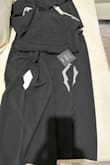 I got the products but one of the clothes have cut both side of the jumper. I don't know if you guys send with damage or the delivery person open the package and cut the clothes. A nice jumper but a little longer for 5'0 feet. - Mony F.
