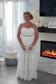 This dress is so beautiful. I wore it for our vow renewal. I added the belt. I had tons of compliments on it. I'm a size 12 and had to order the extra large. - Amy A.