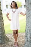 This dress fits true to size and actually really comfortable! The color is even prettier in person but it is lighter than the color on the website! - Whitley R.