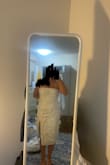I wish I had sized up, but I selected the size that Lulus told me to (M). I am a medium in every store and in every style, but I cannot zip this dress up past my waist. I considered keeping it and redo-ing the back, but I decided against it because I want a dress that will WOW, and this isn't it. The flowers are beautiful though, and after a good steam, I don't think they would fold over on themselves. The dress is beautiful and if it fits properly, it could look wonderful on someone else. - Claire S.