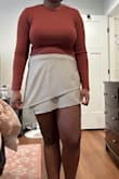 So I bought the skort to match the top. I am returning the skort. But I am keeping this top only because I like how soft the material is. I do not really like how it looks on me since I have a bigger chest but I will make do. I think if you have a smaller chest it will look great. - Christine N.