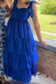 I was really happy with this dress! I got so many compliments! I love the shininess/slight reflection the material gives off. It's kind of noticeable in the pictures, but it really comes through in person/in natural lighting (the second picture shows that well). I really liked the fit of the dress too. I was looking for a full length dress, but since I'm on the shorter side (5'4) I decided to look at "midi" length dresses. This one was the perfect length - right to my ankles. The positioning of the bust was also really ideal. The skirt starts kind of right under your bra line, which is nice so you don't feel suffocated lol - especially if you're someone who bloats easily. Overall - 10/10 purchase!! - Abigail S.