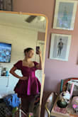 Runs a little small. I got a medium and I'm glad I sized up a bit because it's very difficult to put on and take off. There's not much give in the fabric, and I had to basically completely untie it to get it on. But I'm OBSESSED and I'm very excited to wear it for my Dressed for Broadway series I do! - Jillian H.