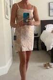 Ordered this for a wedding where the bride requested blush pink, dusty rose, or neutral guest attire. This is the prettiest pink. Fabric looks luxurious, doesn't stretch. Would not work for larger busted ladies. Could get away with wearing a demi cup bra with thinner straps instead of the dreaded strapless. Length is on the shorter side for my liking. Ended up going with a different dress. - Rachel D.
