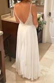 I wanted something simple for my wedding and I wasn't sure about the glitter. However, it turned out perfect! The details of the dress are everything. I didn't use tape or anything else and the dress still stayed in place. I'm not tall at all so I had to have it fixed (just hemmed/cut), but for the rest, everything was perfect! I received a lot of compliments and I felt beautiful! - Estefany R.
