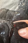 Got for my daughter for hoco. The zipper would zip up halfway and then would get stuck going up at this weird bulge, due to the fabric that was right there. Hard to explain in words. It started tearing as we ever so gently were trying to zip it the whole way. Even when the dress was not on her it was getting stuck halfway, so it wasn't because of the fit on her. It kept getting caught on the fabric. Anyway, we made it work for hoco. But tonight she's going to a hoco at her friend's school and the zipper is now completely unable to be used at all. Such an expensive dress too. Sigh. - Jaclyn W.
