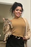 I love this tank top. The color is very warm and goes good with gold. It fits perfectly and I had to get it in every color because I love it so much. - Kamyshia T.