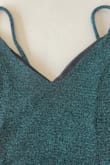 The dress color and material are nice. However, it was sewn in a way that the black interior lining shows on the chest area. No matter how much it was pressed and using dress tape the outer dress material kept falling away and the black lining showed. Disappointed it is not returnable. My daughter won't wear it. - Denise C.