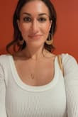 I love this top because you can wear it to work and then turn around and make it into a happy hour top. Love it. Fits true to size. - Melissa B.
