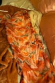 Mesh but the print still shows very beautifully. I shortened my dress, but I love that you can wear it long too. It fits me perfectly and I'm usually a medium size. - Andrea V.