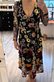 I really wanted to love this dress to have the vibes of the Taylor Swift floral Grammys dress, but it didn't look flattering on me at all. It made my waist look thick, and it just was too much for a petite frame. The only part that didn't look homely was the cleavage, and that was a bit much, especially because the remainder of the dress gives grandma vibes. The material of both the sleeves and the body were uncomfortable and would have felt itchy if worn for a while. I returned it. - Keri S.