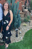 This dress was exactly what I was looking for. The fit was perfect and very comfortable. The back has adjustable strings allowing you to bring it up, down, and as tight as you want it. I altered it and removed the bottom layer because I'm only 5ft tall, making it more of a midi. - Cristina G.