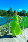 This dress is everything. It's beautiful, comfortable stylish, easy. I purchased it a while back and decided to wear it to this wedding. I second guessed myself and ordered about 6 other dresses. Went to my seamstress to get it hemmed and this was the first one. She loved it on me immediately! So I decided on this one. All the other dresses went back. I have to tell you I got at 10 different people complimenting me on how beautiful this dress was. Gorgeous! I wore it just like the pic with no sash. I wore black flat pointy sling back shoes, black waist leather jacket (cocktail hour was outside) and black bag. I'm 5'0, 120lbs and I ordered a small. - ELIZABETH B.