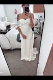 I am eloping soon with my fiancé. I probably tried on over 30 dresses. Some were beautiful but too expressive, others just were missing something. I bought a bulk of dresses from Lulus but still was not really in love but was running out of time. This dress showed up last minute and I was speechless. I'm a little self-conscious with my body but this dress flatters me SOOOO well. It's gorgeous and feels like great material. It's a bit long and I dont plan to wear super high heels but I don't mind, I love the train, the size runs a bit small but I also don't mind because it flatters me. I wish I could submit more photos to show a better view :( - Monica D.
