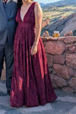 The zipper was challenging to do up when the dress was on a flat surface -- the design has too many fabric layers where the zipper is. However, it got up and stayed up & secure throughout the event. The zipper is the main reason for not giving 5 stars.

Overall, the dress was a great color, texture material, and style for a fall/winter wedding.  It was a bit snug at the waistband (& zipper), but that seemed to help keep the top secure for me.  I wore flats with this dress and it was skimming the ground, but I could have worn a 1-2" heel with this length. The quality of this dress was pretty good with full lining and sticky material under the shoulder straps to help keep the top in place. - KATHRYN S.