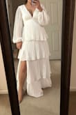 I wore this as my reception dress and everyone loved it! It was still elegant enough to fit the occasion but light enough to dance away the night! It is long, I am about 5'5 and with my 2-inch heels, it was still touching the floor. Would recommend wearing some fashion tape on the chest as it is deep cut - Emily A.