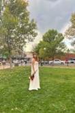This dress was perfect for my courthouse ceremony! :) I will say that even with my 5-inch heels, the dress was still a bit too long so I'd recommend getting the bottom hemmed. Otherwise so lovely :) I tied the bows a bit differently on the straps too so have fun playing around with different looks! - Graelyn K.
