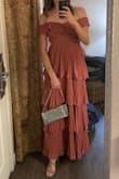 This dress in the Dusty Rose is beautiful. However for my athletic body type, wide shoulders, small bust, and no curves, it didn't fit that great. Since I don't have hips the skirt felt too heavy. And the top didn't have much structure. So I altered the dress so that it fits better. 
It fit me better after alternation and looked beautiful. - Anastasia A.