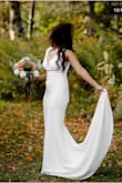 Fits well. Material looks elegant but is a little see thought. Will need to wear shape wear. Wore it for my elopement wedding. Looked great! - Ruchi T.