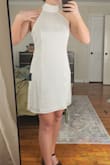 I got the large and I think it's a great dress. I'm going to have it steamed and tailored so the chesst is raised up a bit (like in the second pic) i want the front darts to line up with the top of my boobs and that's a easy fix. Its double lined and the fabric feels really nice. Remember, going to a tailor isn't that expensive when the result is a perfectly fitted dress. So if you're nervous about the fit, size up and just take it to a tailor. I promise it's easy and you'll love the dress alot more than buying a more expensive dress that still isn't tailored to your body and may not fit right. - Rilyn A.