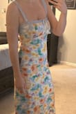 I took a shot in the dark with no other photo reviews- so I'm glad I can help out other people. I plan to wear it to a destination wedding in Jan. The chest area is tight but I'm a 32DD so that might be the issue. It's definitely do-able though- and I have on a strapless bra. The straps are lace and not adjustable but I think it'll work for me. Length is true midi and I'm 5'6 and about 138 lbs. - Christine W.