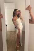 Overall, a beautiful dress with great quality. The fabric is quite thick and stays in place. The slit isn't too high. However, I chose something else for my engagement shoot. - LOUVIA L.