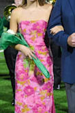 Bought this for my daughter's Homecoming Court.  Size small and fit like a glove - was able to move, walk, and sit comfortably, but not a lot of room to spare so leans towards a very slender sizing. Colors pop in pictures. - Courtney M.