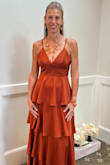 The gown was an absolute dream!  The material felt like butter and was so luxurious. The craftsmanship was flawless. The fit was perfect - like it was tailored just for me.  I received countless compliments.  The color was stunning for a fall wedding.  This dress was a perfect match for a magical day.  Please note - I did take the dress to dry cleaners to be pressed. - Christeen I.
