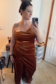 I ordered my normal size per the reviews, but it runs really large. I probably could have gotten away with ordering a medium with how much the fabric stretched when on and how heavy it was. I'm a 36DDD, so 36F and the bust was huge on me, the slit also came almost up to my crotch when walking. Absolutely gorgeous and would have loved to make this work, but unfortunately I now have to return it and go hunting for a new dress the same day as my work gala. - Stephanie R.