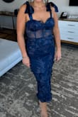Absolutely beautiful, fit great. No stretch to the dress. - Melissa B.