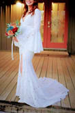 This dress was exactly what I was searching for, for my wedding! It has the high leg slit, the perfect sleeves, and a beautiful train! I hesitated a bit about buying a dress online for my wedding but, I have no regrets at ALL! It was perfect. For reference,e I normally wear a size small in Lulu's dresses for a normal fit. I wear XS for a "snatched" fit. This dress was only available in an XXS and I was scared it wouldn't fit!!! I bought it anyway and added a super tight shapewear underneath to ensure I could fit in the dress! It worked perfectly for my wedding and am so thankful for Lulu's for having such aan ffordable dress made with superior quality! - Holly S.