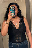 This bodysuit is so cute! I bought a L and XL- I liked the fit of the body XL but the lace panel part was too big. The L fits pretty well but makes me feel a little sausagey. Since it's black though I don't think I look that fat and it's still very comfortable. The lace detail is so cute and the v-neck plunge is perfect in that it shows some cleavage but I can wear a regular bra with it without it showing. I am a 34G and the chest does not feel tight at all. 

The snaps are very secure and while I have not worn this yet I've done many squats and lunges and the bottom doesn't ride up uncomfortably at all. Overall I'm really happy with my purchase

Update: One of the best purchases I've made, ever! Wore this to a Girls Aloud concert and Taylor Swift concert and it was so cute and comfortable - Nancy L.
