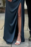 The wide heel makes them easy to walk in, they fit well but I needed to add an extra hole in the ankle strap to keep my foot from sliding forward (picture from before I did that, hence my toes hanging off the front). I was very happy with this purchase for the price - Kayla B.