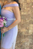I bought this dress for my simple yet sweet courthouse wedding. I added a special touch by adding a tulle over the skirt. I ordered a size small and medium with the intention of returning whichever didn't fit. Glad I did bc the small is super small. So yes, according to other reviews, this dress runs small.  I got it altered to make it shorter, above the knees. As other reviewers had done, I opted to wear the sash over my shoulder and I think it looks way cuter that way. The zipper was extremely difficult to zip up, I was always afraid of busting it. The material is nice and semi-stretchy, adding to comfort. Super happy with this purchase! I would definitely recommend this dress! - Elsa C.
