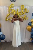 I bought this dress for my bridal shower. I had it hemmed and had the slit closed a little. Then it was perfect. I got so many compliments. The bows were my favorite part. Sooooo pretty. If my wedding was a more casual vibe, it could definitely pass for a wedding dress, too! - Kimberly C.