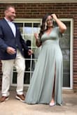 Showed a whole lot of cleavage so I did have it tacked a little :) It was super long, though...even with heels. - Shelly F.