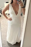 I was hoping to love this dress, but the plunge is so deep. Might be better on someone with a longer torso. The waist felt fine so I wouldn't go down a size, but my boobs would have fallen out. Don't think it compliments my shoulders either. - Amalie Z.