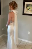 I bought this on sale! And oh my gosh. I loved it. This style was exactly what I wanted. I did get it taken in a little, but being 6'1" the length was perfect. I ended up barefoot because it poured during our ceremony. I also added lace to the back, had it bustled, and had the bow clip on for the ceremony (no veil) - Lindsay F.