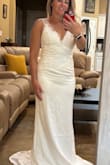 This was a very pretty dress. It was a tiny bit tight on me so I didn't feel like the fabric was very forgiving. I was looking for a dress with some kind of beading or sequins so I didn't pick this one for my wedding. Overall, it is a beautiful dress though! - Tiffany C.
