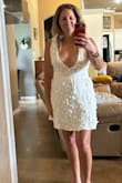 I feel in love with this dress and planned to get married in it. Our wedding date got postponed to winter so this was a no go. It is super low cute and I would have gotten it altered to fix that with mesh or something a little less revealing. I was really drawn to the open back. - Tiffany C.