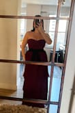 I wore this to an October wedding and loved it. The pleated and tiered skirt is really elegant. And the color is great in person (this photo doesn't do it justice.) I've seen in other reviews that the zipper is low quality and I agree. But once I was finally able to get it unstuck and fully zipped, it was fine. I also added a belt at the waist which I recommend if you have a large chest. Otherwise, the bodice was too short and almost an empire waist on me. - Meghan G.