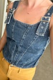Snagged this because it's simple enough for my wardrobe to go with a lot of things, but also adds a spice with it being denim and the buckles. I would recommend it, it's got some stretch on the sides, and has a high neckline for me at least that doesn't show cleavage. - Brandie R.