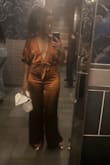 I absolutely love this jumpsuit!! I received so many compliments from women and men all night. I was nervous regarding the size reviews since I have a booty but small up top. Medium fit perfectly. I just made sure to put a little double sided tape to keep the top in place. Material is thick on the pants as well which is great on these chilly nights. - Chantelle A.